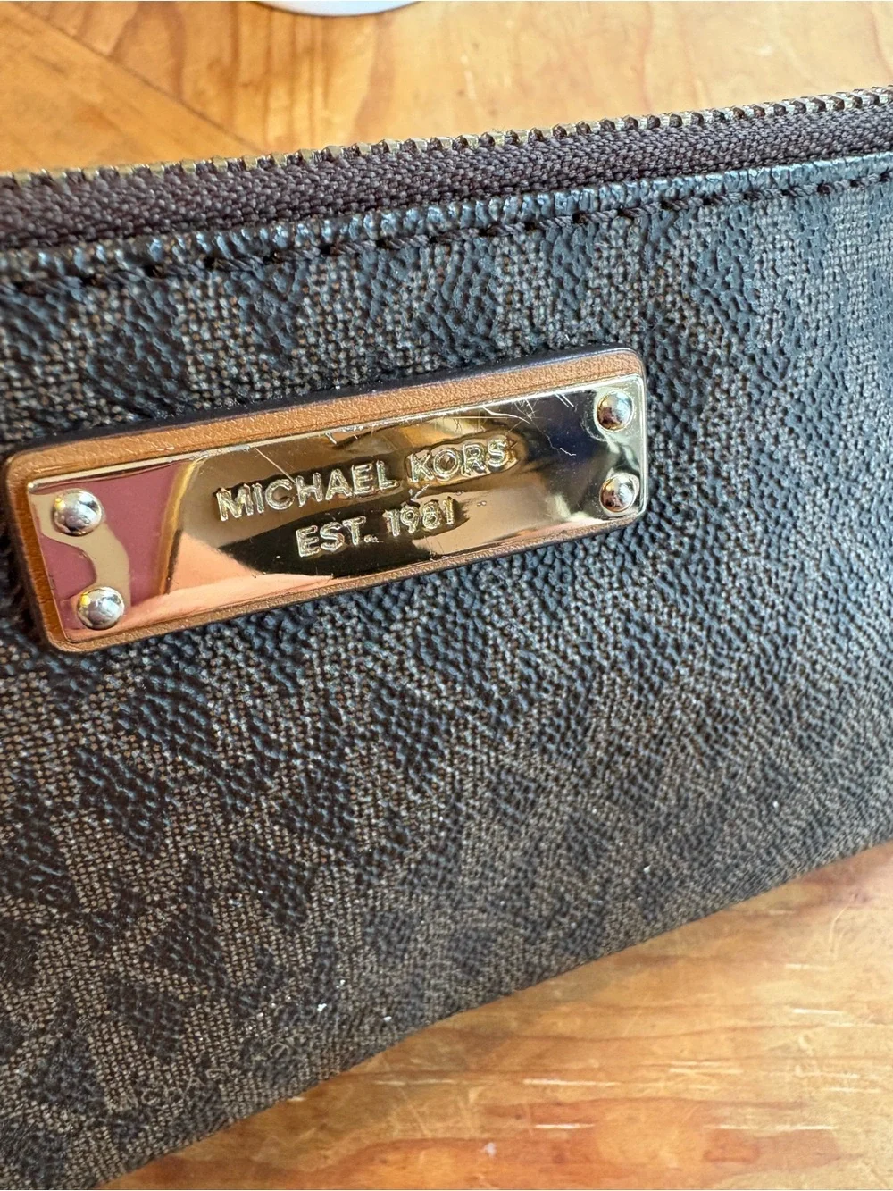 Michael Kors Brown and Tan Signature Wristlet with Gold Plate